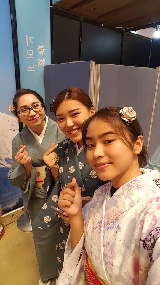 Alex Sato does the Korean heart sign with her new friends